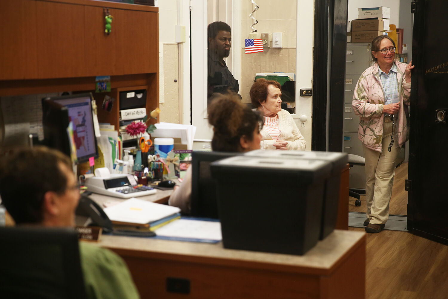 Mary Klaahsen, right, stands in the doorway to the back room